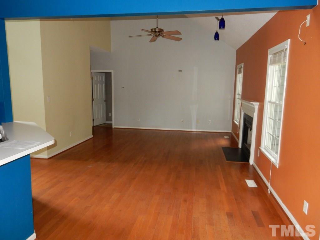 5313 Denmead Way Raleigh, NC 27613 - Photo 6 of 18 a view of a room with wooden floor and a window