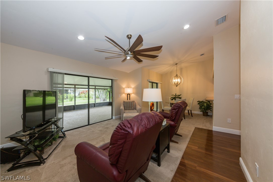 13258 Heather Ridge Loop Fort Myers, FL 33966 - Photo 11 of 22 a living room with furniture a ceiling fan and a flat screen tv