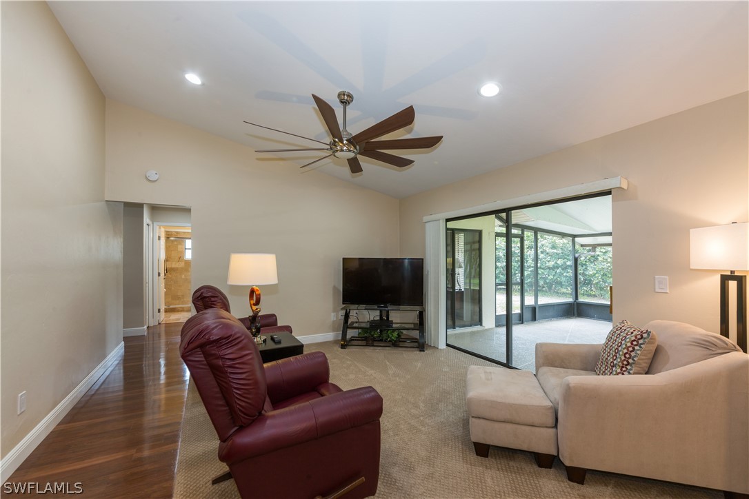 13258 Heather Ridge Loop Fort Myers, FL 33966 - Photo 12 of 22 a living room with furniture a ceiling fan and a flat screen tv