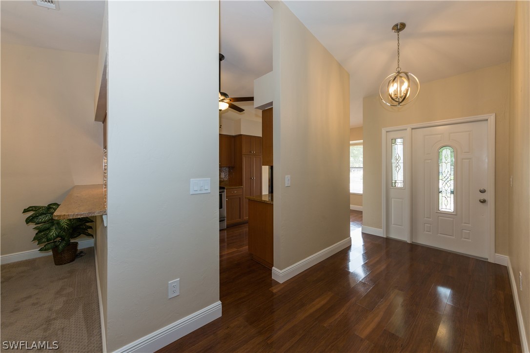 13258 Heather Ridge Loop Fort Myers, FL 33966 - Photo 3 of 22 a view of a hallway with wooden floor and closet