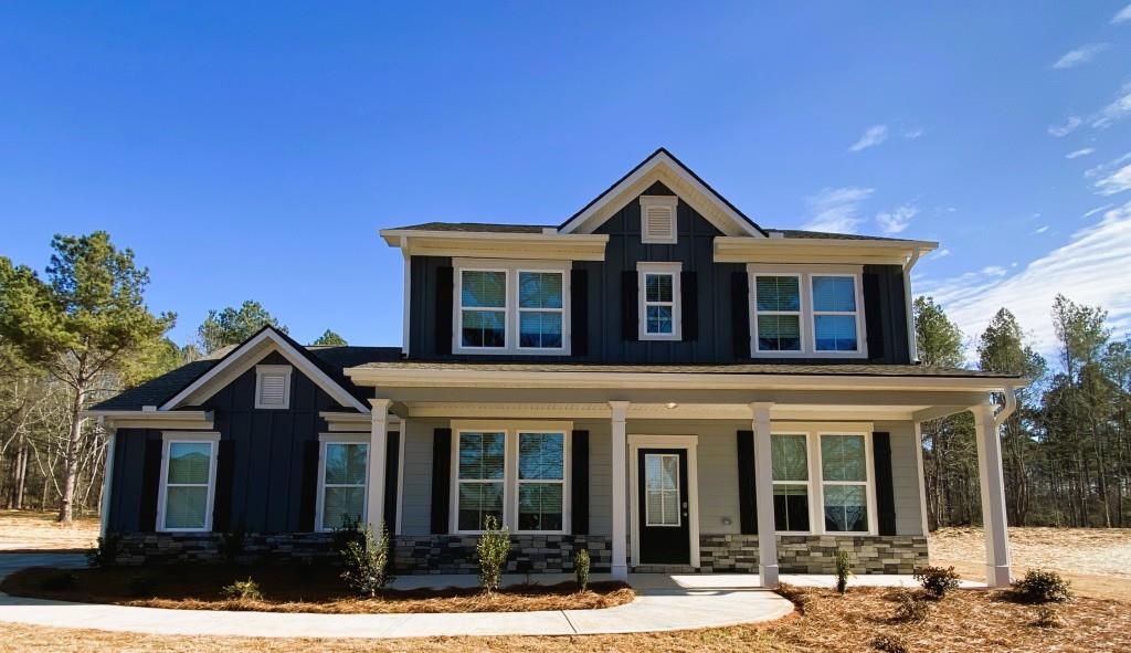 127 Jim Daws Road Monroe, GA 30655 - Photo 1 of 1 a front view of a house with a yard