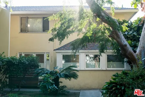 front view of house with a tree