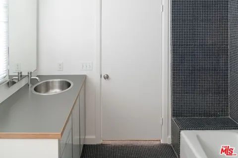 a bathroom with a sink and a bathtub