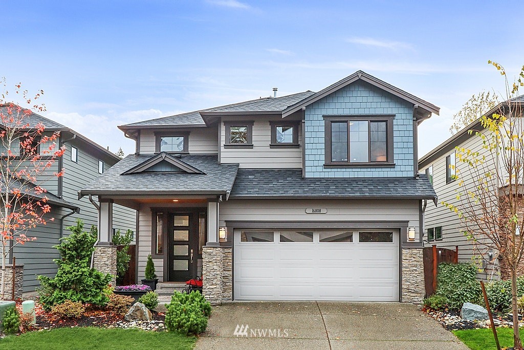 16808 1st Avenue West Bothell, WA 98012 - Photo 1 of 29 a front view of a house with garden