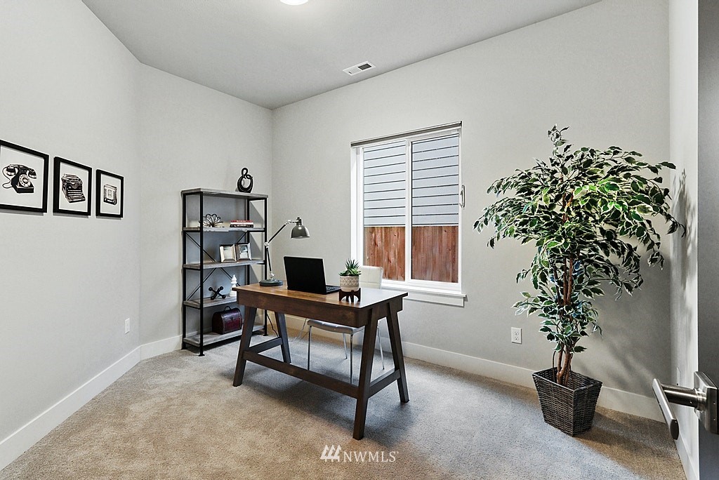 16808 1st Avenue West Bothell, WA 98012 - Photo 15 of 29 a view of a workspace with furniture and a potted plant
