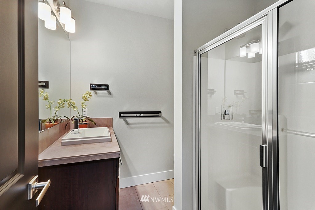 16808 1st Avenue West Bothell, WA 98012 - Photo 17 of 29 a bathroom with a sink vanity and a mirror