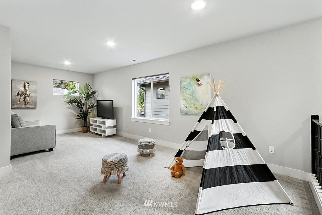 16808 1st Avenue West Bothell, WA 98012 - Photo 18 of 29 a bedroom with furniture and a window