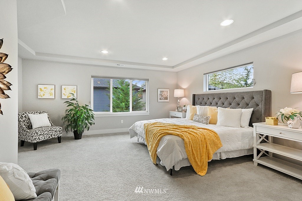 16808 1st Avenue West Bothell, WA 98012 - Photo 20 of 29 a spacious bedroom with a bed and glass window