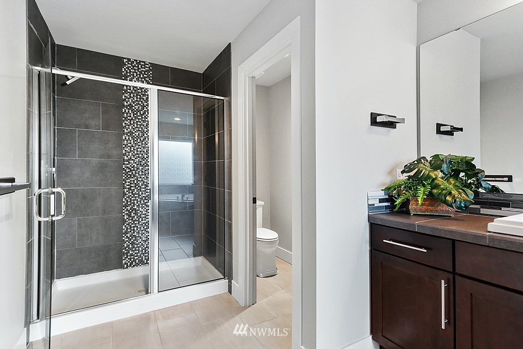 16808 1st Avenue West Bothell, WA 98012 - Photo 22 of 29 a bathroom with a shower and a sink