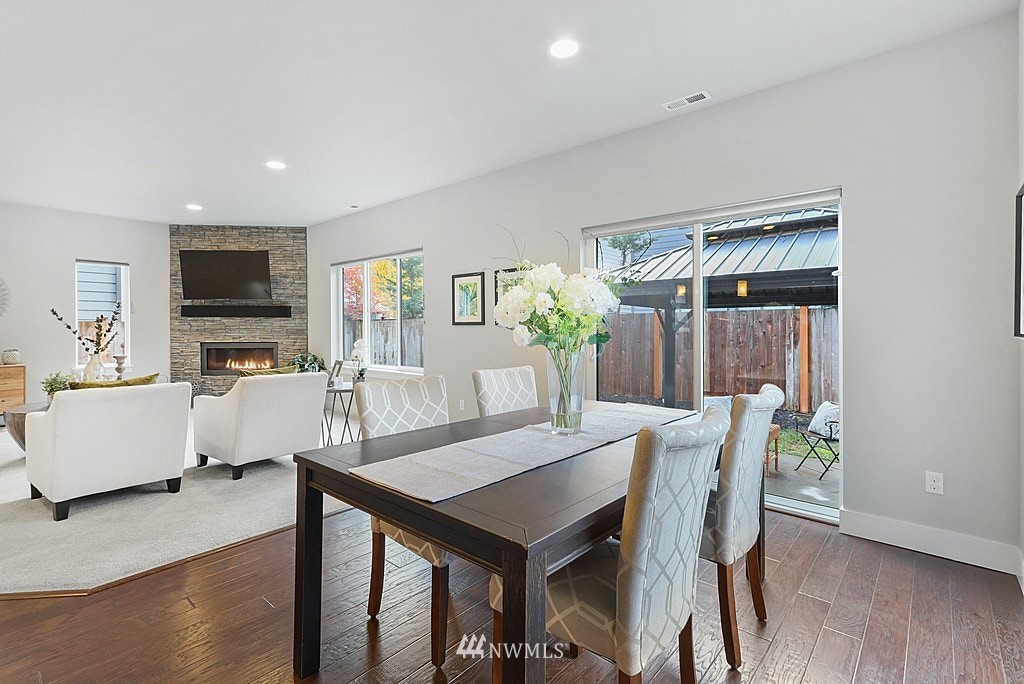 16808 1st Avenue West Bothell, WA 98012 - Photo 8 of 29 a view of a dining room with furniture and wooden floor