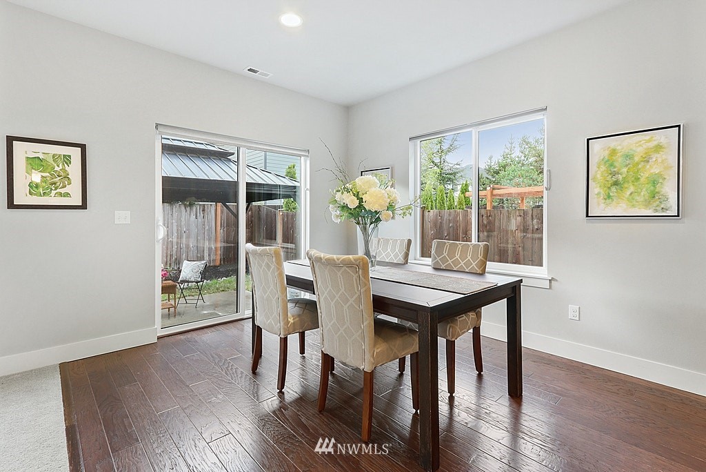 16808 1st Avenue West Bothell, WA 98012 - Photo 9 of 29 a view of a dining room with furniture window and wooden floor