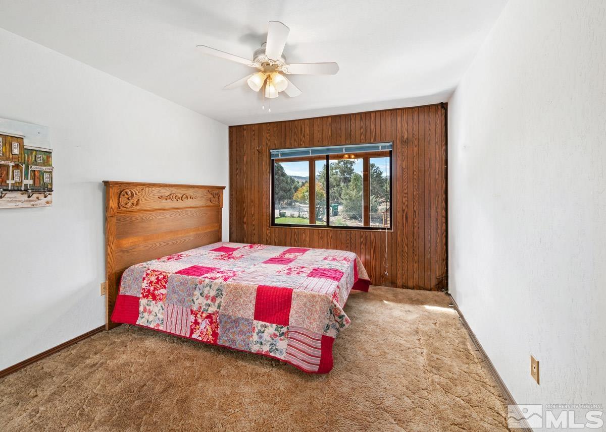 15866 Toll Road Reno, NV 89521 - Photo 18 of 29 a bedroom with a bed and a window