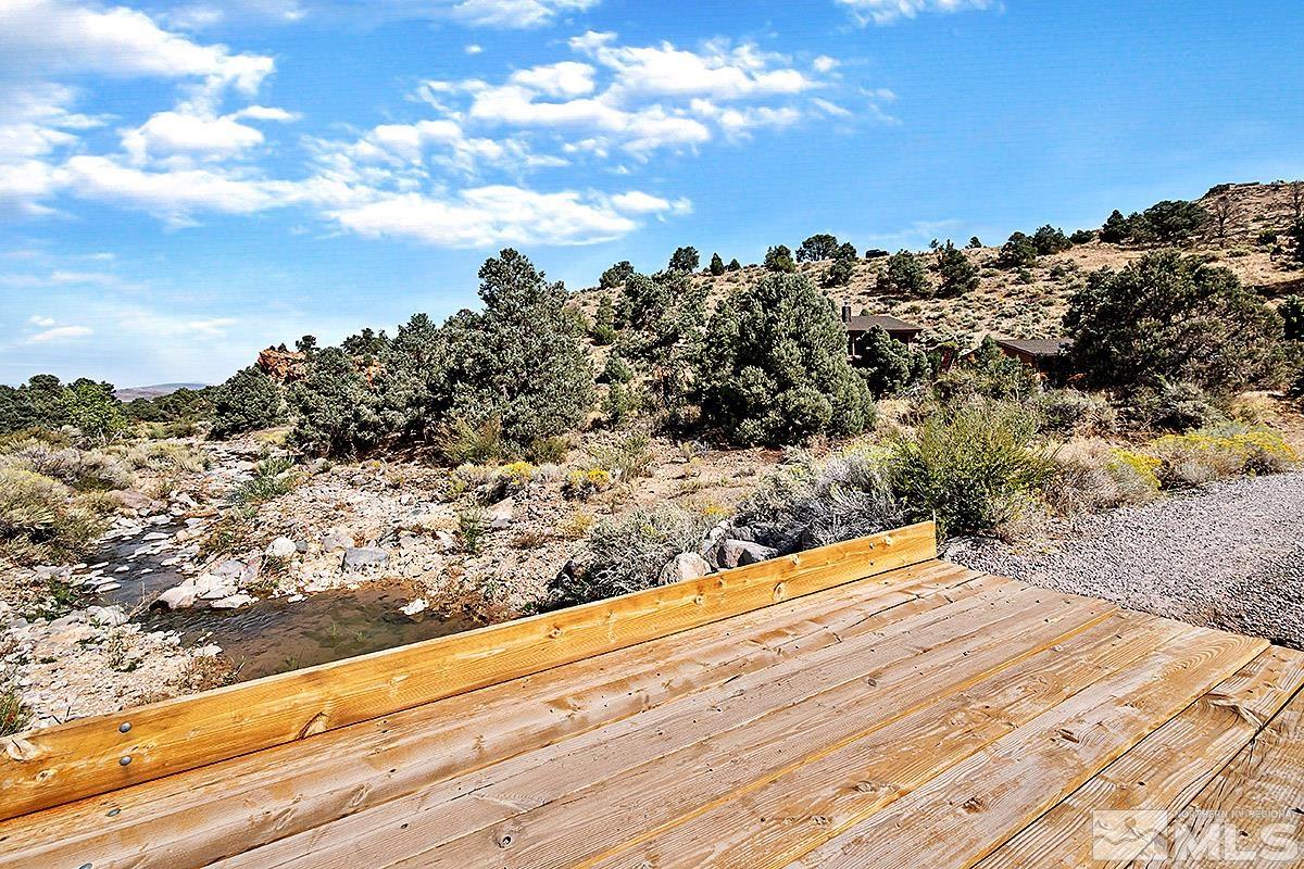 15866 Toll Road Reno, NV 89521 - Photo 27 of 29 a view of a yard with wooden fence