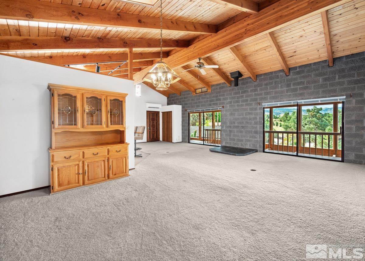 15866 Toll Road Reno, NV 89521 - Photo 7 of 29 a view of an empty room with a kitchen