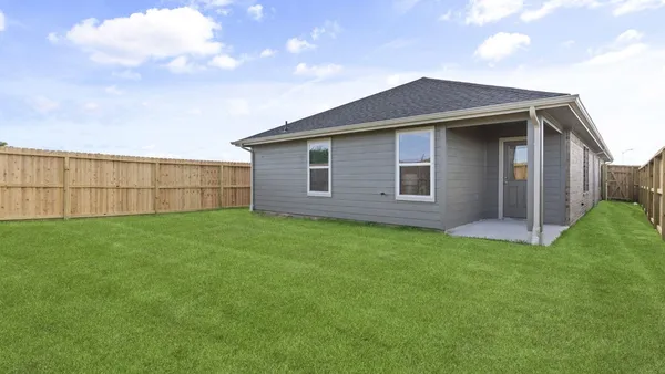 a backyard of a house with lots of green space