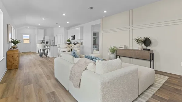 a living room with furniture and a table