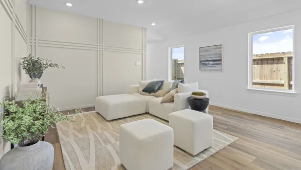 a bedroom with furniture and a potted plant