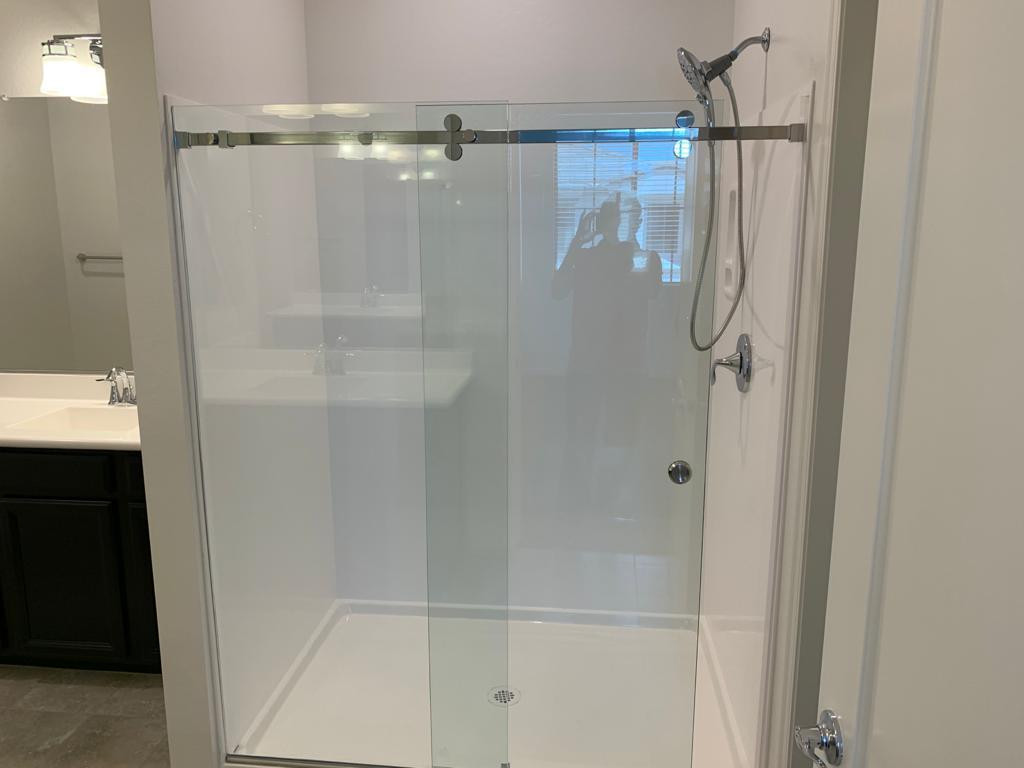 3900 East Baseline Road, Unit 118 Phoenix, AZ 85042 - Photo 12 of 32 a bathroom with a glass shower door