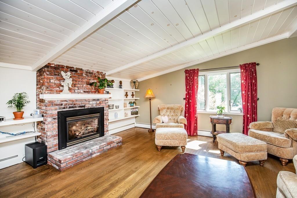 300 Locust Street Danvers, MA 01923 - Photo 17 of 41 a living room with furniture and a fireplace