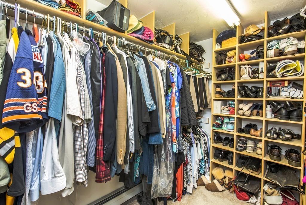 300 Locust Street Danvers, MA 01923 - Photo 21 of 41 a view of walk in closet with clothes and shoes