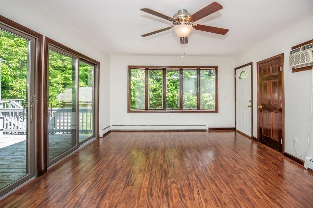 300 Locust Street Danvers, MA 01923 - Photo 29 of 41 a view of an empty room with wooden floor and a window