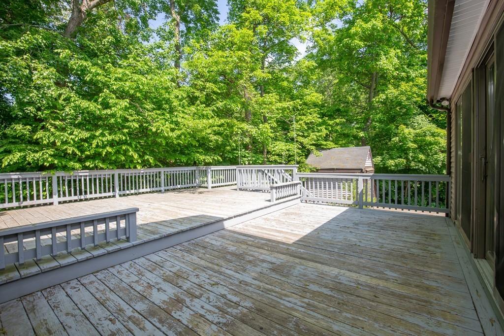300 Locust Street Danvers, MA 01923 - Photo 31 of 41 a view of balcony with wooden floor and fence