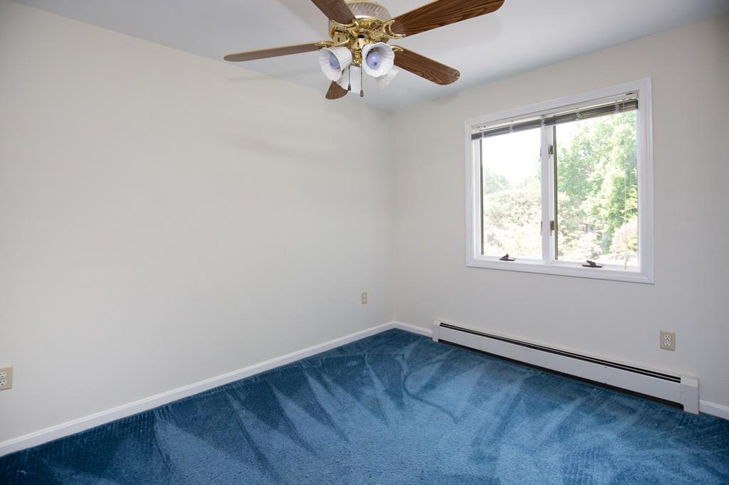 300 Locust Street Danvers, MA 01923 - Photo 37 of 41 an empty room with a window and a fan