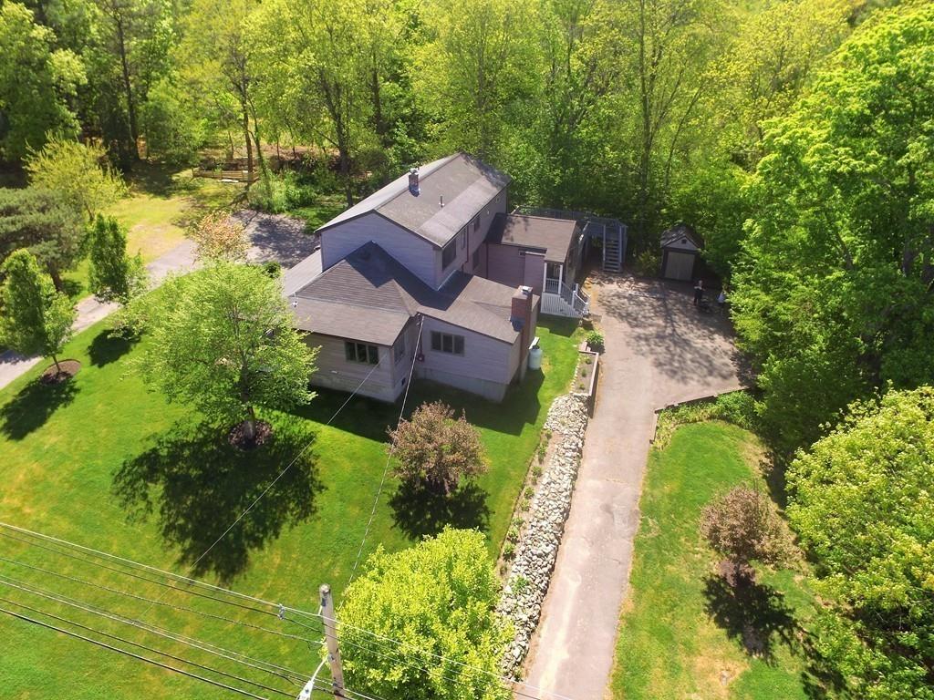 300 Locust Street Danvers, MA 01923 - Photo 8 of 41 an aerial view of a house with a garden