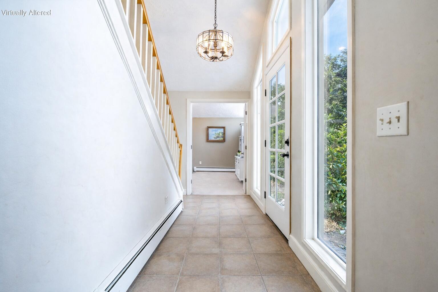 129 Colonial Way Falmouth, MA 02540 - Photo 25 of 46 Bright hallway with glass door and green