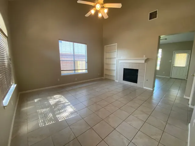 a view of livingroom with furniture fan and window