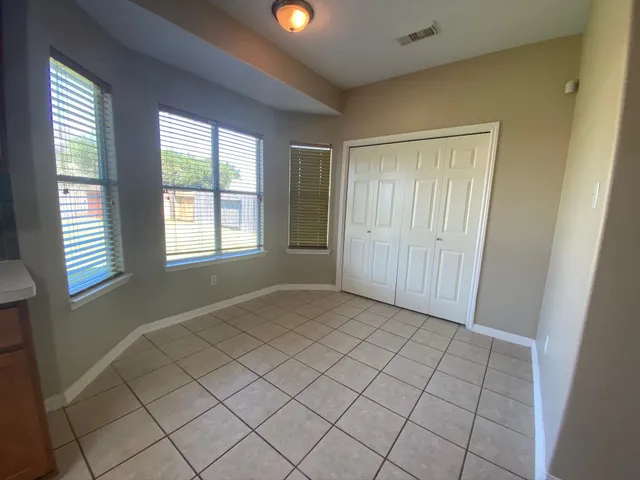 a view of an empty room and window