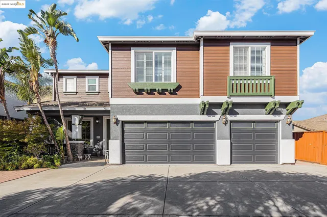 a front view of a house with a garage