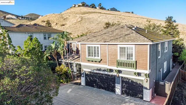 a view of a house with a backyard and balcony