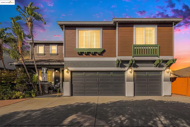 a front view of a house with a garage