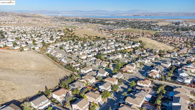 an aerial view of multiple houses with yard
