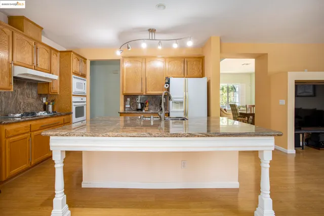 a view of a kitchen counter top space cabinets and stainless steel appliances