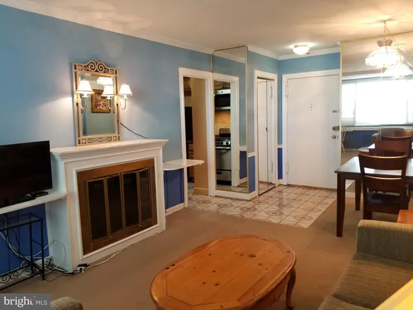 a view of a livingroom with furniture and a fireplace