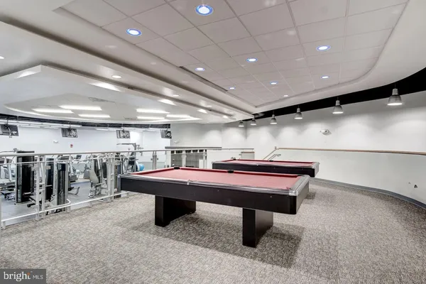 a room with lots of furniture and a projector