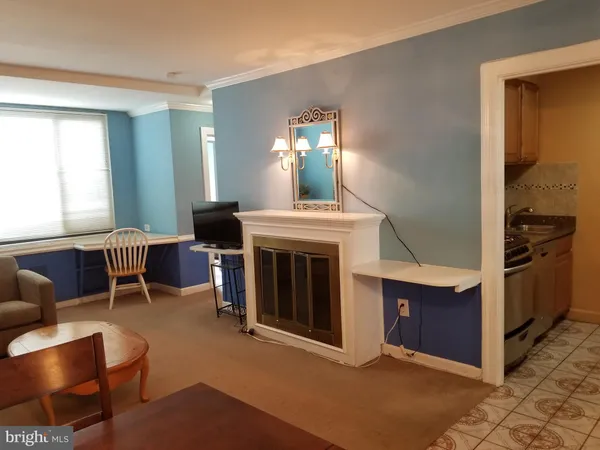 a view of a livingroom with furniture and a fireplace