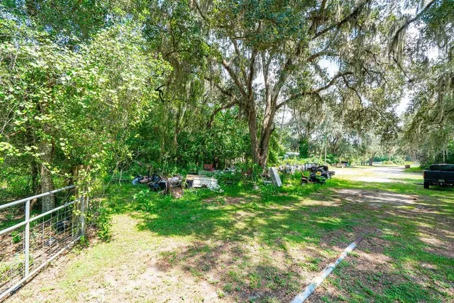 a view of backyard with swimming pool