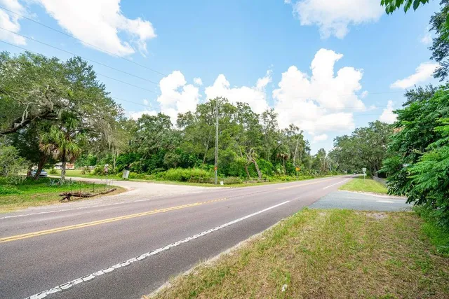 a view of a swimming pool with a yard