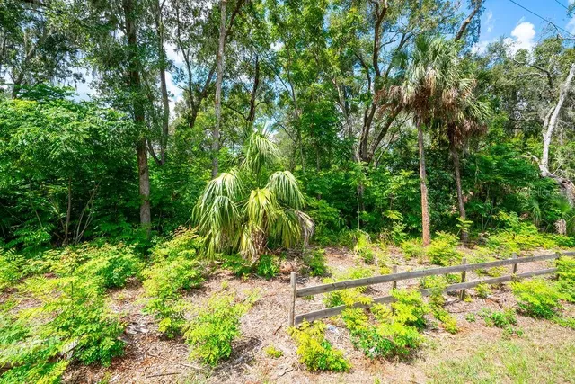 a view of a swimming pool and a yard