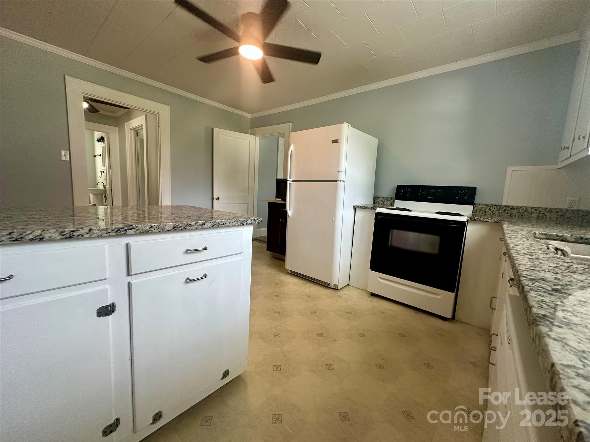 128 Market Road Mooresville, NC 28115 - Photo 11 of 20 a kitchen with granite countertop cabinets stainless steel appliances and a counter space