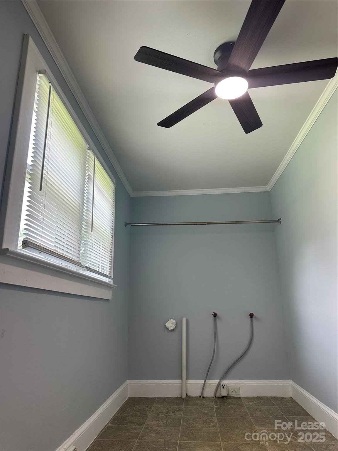 128 Market Road Mooresville, NC 28115 - Photo 13 of 20 a view of empty room with wooden floor and fan