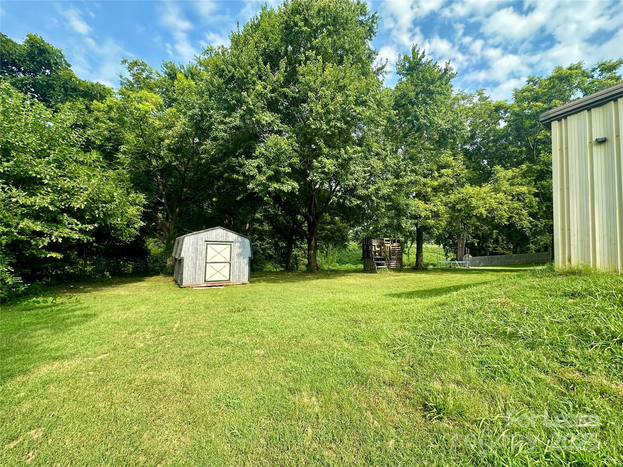 128 Market Road Mooresville, NC 28115 - Photo 20 of 20 a view of a trees with a yard