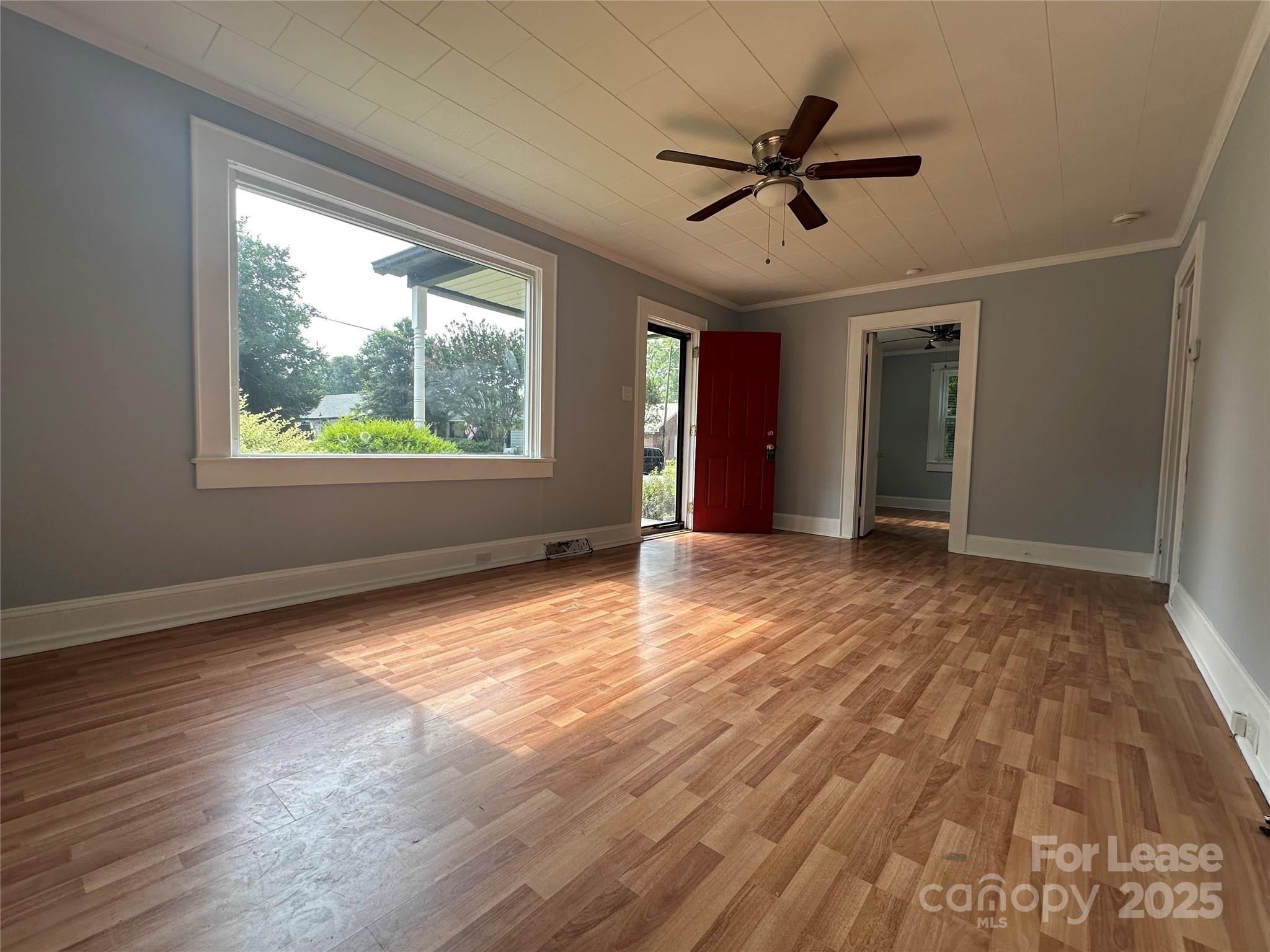 128 Market Road Mooresville, NC 28115 - Photo 5 of 20 wooden floor in an empty room with a window