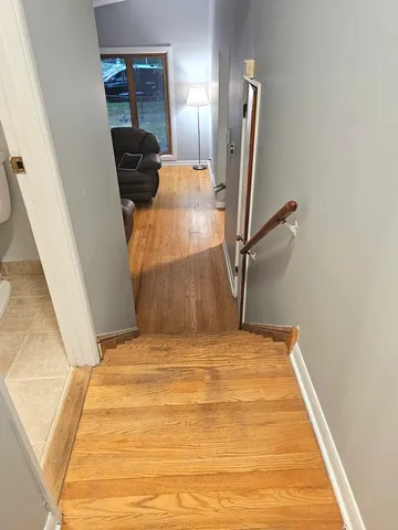 a bedroom with a bed and a large mirror