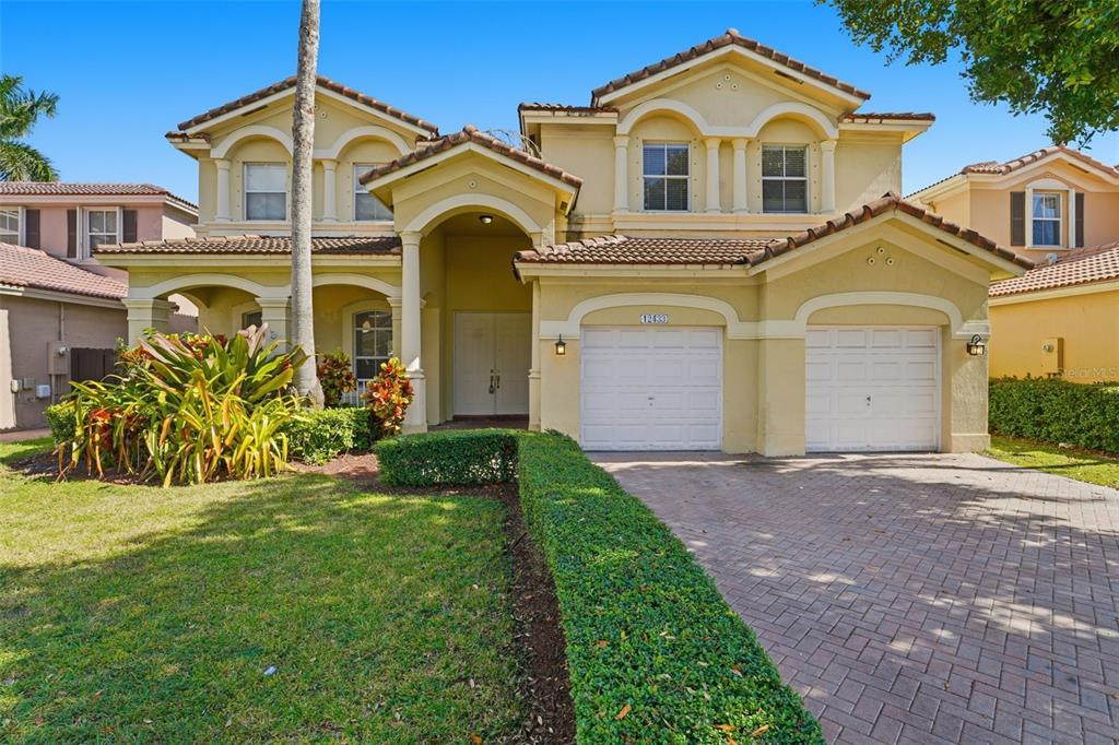 a front view of a house with a yard