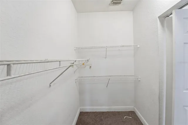 a bathroom with a sink a bathtub a mirror a vanity and a shower