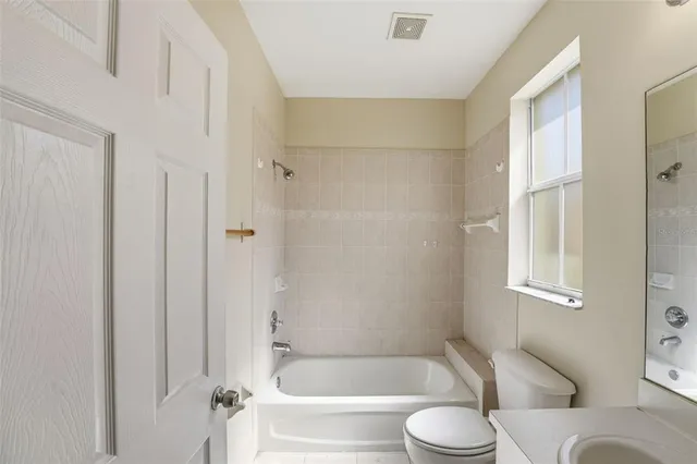a bathroom with a shower and a sink